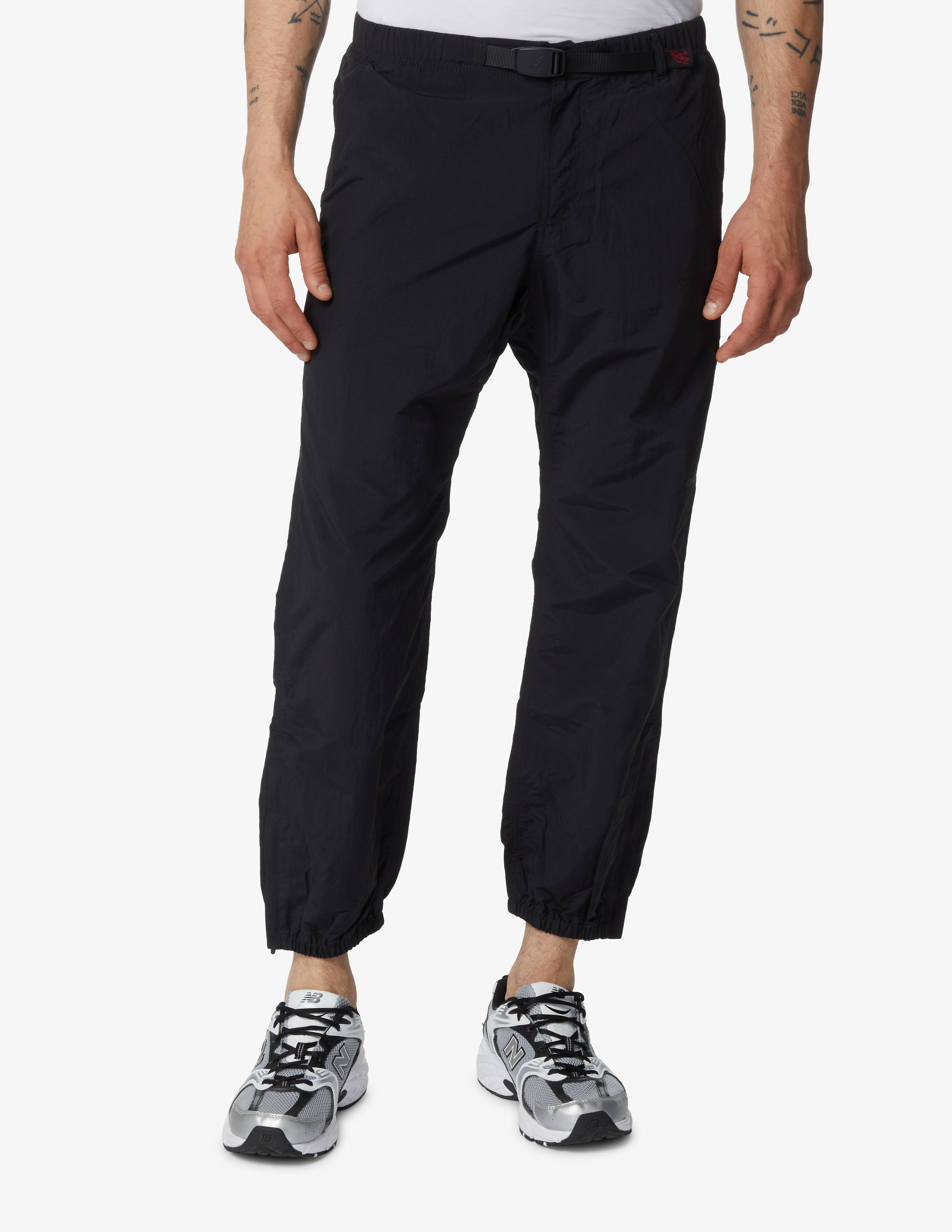 Shop Gramicci Nylon packable track pants - black on Rinascente