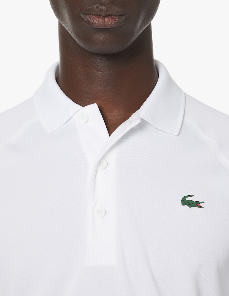 rinascente Lacoste Polo sport manica corta bordini - bianco