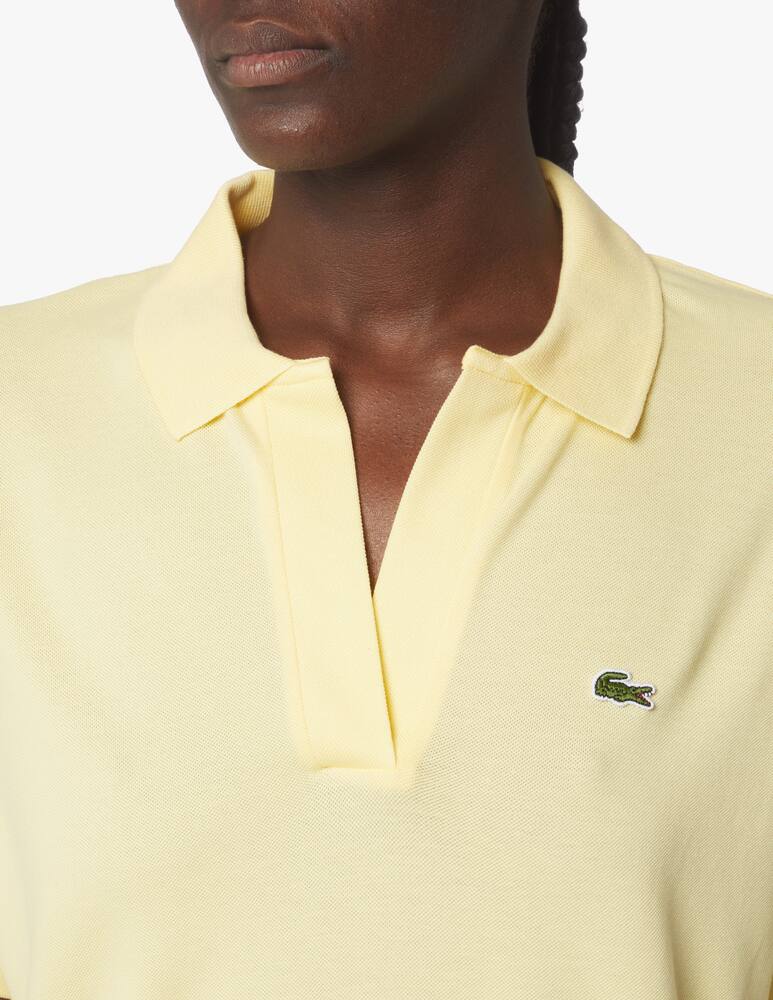 Shop Lacoste Cotton blend polo shirt without buttons yellow on Rinascente