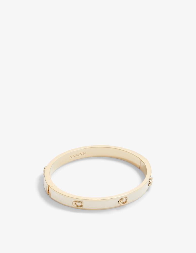 COACH Bracciale rigido smaltato Signature - immagine 1 COACH Bracciale rigido smaltato Signature - immagine 1