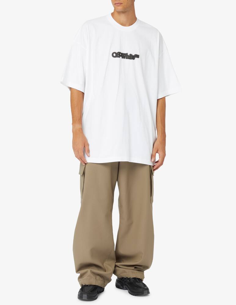 rinascente Off-White Blurr book over t-shirt