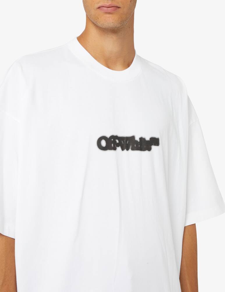 rinascente Off-White Blurr book over t-shirt