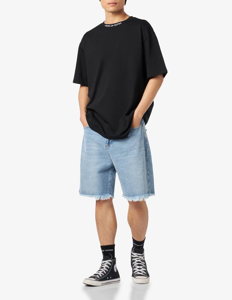 rinascente Vision of Super Jeans con fiamme e logo