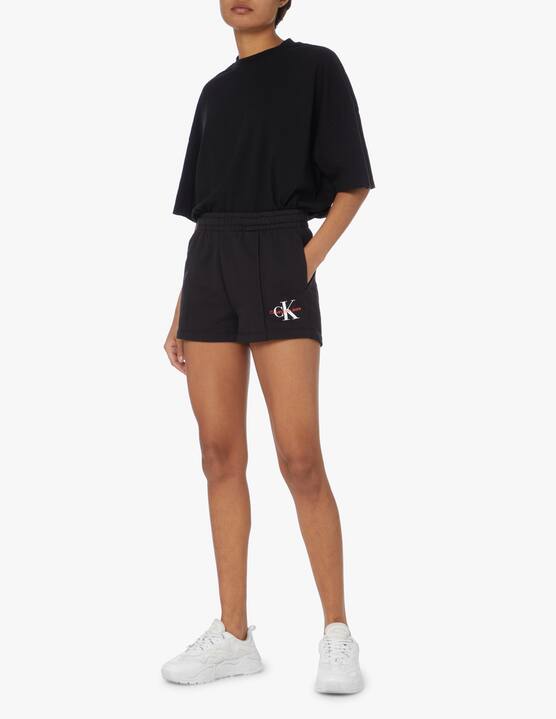 Calvin Klein Jeans - Pantaloncino tuta con logo monogramma - nero - €59,90